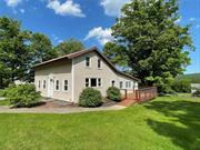 Experience the serene charm of upstate NY living in this inviting 2+ bedroom farmhouse boasting picturesque mountain views. THREE additional flex rooms to meet your personal needs. Embrace the allure of elegance with granite countertops, stainless appliances, hardwood floors, enclosed porch, and a spacious deck, perfect for enjoying the abundant sunlight and tranquil surroundings. At the end of the day, cozy up to the fireplace in the bonus room. Great for working at home with additional office as well. Complete with a barn, garage, and mature plantings, this property offers the ideal blend of comfort and countryside charm. Located within minutes to the Ashokan Reservoir and Rail Trail too!