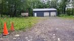 Large garage (1200 square feet) with a lot of potential! It&rsquo;s not only a place to store stuff. Its size and sturdy construction make it an adaptable area for various activities. It has plenty of parking space on a 3/4-acre site but no water or sewer connection. Currently, power is provided via an extension cord from the house, a convenient arrangement for the former owner who used the area to construct race cars. The property is zoned residential; however, the garage was used for industrial usage.  What fascinating project will you take on here? *No showings on Saturday.