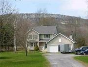 Dreaming of living with a gorgeous view of the mountains? This home is that dream come true! A home where you can wake up to breathtaking views of the Shawangunk Ridge, creating a picturesque backdrop for your daily life.  Whether you&rsquo;re sipping your morning coffee or enjoying an evening sunset, the natural beauty of the Shawangunk Mountains will captivate you. The expansive yards provide plenty of room for outdoor activities, gardening, and relaxation. Imagine hosting barbecues, playing catch, or simply basking in the sun. Say goodbye to high energy bills! This home features a fully owned solar system, allowing you to harness the power of the sun while minimizing your environmental impact. Step inside to an inviting, spacious and comfortable space with ample room for gathering, each room flowing into the next.  Cozy up to the fireplace and unwind.  Located just 10 minutes from the supermarket and 20 minutes from the New York State Thruway, this property strikes the perfect balance between convenience and tranquility. This road has a beautiful bucolic setting with a lovely horse farm nearby as well as Wildflower Farms Auberge, The Mohonk Preserve and Full Circle Gardiner. Gardiner also boasts a variety of beloved restaurants including Lombardi&rsquo;s right down the road. Ready for some Outdoor Adventures?  Skydiving, rock climbing, and hiking are all within reach. Wineries, Breweries, Distilleries, farms and Orchards to visit too. Enjoy nearby New Paltz and the outdoor wonders of the Hudson Valley. Come take a look!