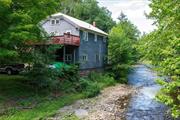 Highly visible building at the crossroads of Callicoon, North Branch, and Hortonville. The 2 unit building is perfect for live-work opportunities with its commercial and residential zoning. Featuring two expansive decks overlooking Callicoon Creek, it offers scenic views and a serene atmosphere.  The ground floor is ideal for a retail shop or offices, benefiting from high visibility from Route 17B. The second floor houses a spacious three-bedroom apartment with a large eat-in kitchen and a generous deck, perfect for outdoor dining and relaxation. Additionally, the property includes a loft-like attic that can serve as an extra sleeping area or storage.  With its mixed-use commercial zoning and prime location, this property provides great versatility for entrepreneurs and small business owners looking to blend work and home life seamlessly. Minutes to the Callicoon, Delaware River, Bethel Woods, breweries, cideries, dining and much more. Don&rsquo;t miss this unique opportunity!!