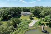 Indulge in coastal living at its finest with this meticulously maintained one-level home in a charming beach community. Renovated in 2012 by Fokine Construction, this home offers stunning water views of Menantic Creek from most rooms. The open-plan layout features a vaulted living room with fireplace, dining area, and a custom chef&rsquo;s kitchen. Step onto the water side deck for a serene outdoor retreat with mahogany railings and stainless wire. The primary bedroom boasts two walk-in closets and a luxurious en-suite bathroom. Enjoy the tranquility of the 1.29-acre shared parcel extending into the creek. This quiet enclave offers the perfect blend of luxury and natural beauty for coastal living at its finest. The shared parcel is 50% ownership of 3 Hagar Rd 700-18.-3-41, 1.29 acre vacant parcel. 1/2 taxes =$1, 280.62