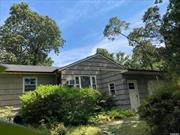 Privacy abounds with this 3 bedroom, 2 bath unique home with lots of character. Set on 0.46 acre lot.Lots of mature plantings with lovely flowering shrubs. Great location, It&rsquo;s three blocks to East Landing Peconic Bay beach. Great summer retreat or year round home. Just Waiting for you to add your special touches and make it your own. Being sold As-is, Where-is