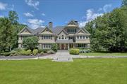 Elegant and sophisticated, shingle style Colonial sited on 3.46 acres of level, idyllic, private property in one of Chappaqua&rsquo;s most coveted neighborhoods. A private, gated drive introduces this 5 bedroom, 8, 000+sq ft home, built by the renowned McKenna Associates, known for quality construction and meticulous workmanship. Designed with luxury finishes and amenities, this home combines both elegance and comfort boasting gleaming hardwood floors, custom millwork, stone fireplaces and more. An impressive double height entry foyer with a sweeping circular staircase opens to formal spaces, a large study, a gourmet Chef&rsquo;s kitchen with radiant heated floors, top-of-the-line appliances (2 Thermador ovens, Bosch dishwashers, Viking 6-burner range with griddle, SubZero, refrigerator), a huge island with counter seating, breakfast room and doors to an expansive deck overlooking the idyllic rear yard, a butler&rsquo;s pantry with icemaker, warming drawer and prep areas, and an expansive family/great room boasting an impressive floor-to-ceiling stone fireplace. The upper level offers a private primary suite with dressing room, two large walk-in closets, and spa bath with radiant heated floors and steam shower. The primary suite also has a walk up loft space currently fitted as a custom closet. Three very large bedrooms, all with their own baths, and an upstairs laundry complete this level. A staircase off the second level leads to a loft area perfect for play/homework or office and access to the enormous attic for amazing storage (and future finished space, if wanted). The home is completed by an expansive walkout lower level with a large recreation room, a walk-in temperature controlled wine room, an office/guest room, 2 full baths, homework/desk area, multiple storage areas and pristine mechanical room. The level backyard (with probable pool site) is perfect for play or entertaining. This Whippoorwill neighborhood home is sited on exquisite property with stone walls and rolling lawns. NEW Roof July 2024, whole house Briggs Stratton generator, electric vehicle charger, whole house audio system, Wifi thermostats, heated garage with epoxy flooring and more! Minutes to town and schools. 50 minutes to NYC. An EXCEPTIONAL Chappaqua offering!