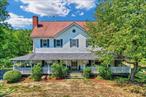 Imagine coming home to your very own country style oasis nestled on over 2.5 acres in the scenic Hudson Valley. With its inviting landscape, large carriage house and desired wrap-around porch this unique 1800&rsquo;s farmhouse is filled with traditional features, updated yet still keeping its vintage country charm. Just 1 hour from New York City, this home offers the best of both worlds.   Upon entering this home, you will be met with a parlor and formal staircase, a captivating and cozy floor to ceiling stone fireplace, and endless space on your main level. In keeping with its traditional feel, the dining room and living room are both centered in this home ready for memories to be made. With a primary bedroom filled with natural light and full bath the open concept first floor features an eat in kitchen with plenty of cabinet and counter space. The kitchen is accompanied by sliding doors to the outdoor deck, perfect for entertaining. The second level of this home you will find three spacious bedrooms, a second full bath, a flex room ideal for home office or den and a full walk-up attack. You will not be short on space or storage in this home.  Your soon to be farmhouse is located directly across over 3, 000 acres of Highland Lake State Park and miles of Camp Orange Trails for biking and hiking. Your future awaits in this unique home just waiting for your personal touches!