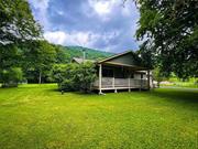 Located on the banks of the famed Beaverkill River, in the charming hamlet of Cooks Falls, this single story ranch home is quality through and through. Three bedrooms and two and a half baths with an open living, dining and kitchen area that is absolutely perfect for entertaining friends and family. The interior has heated floors, woodburning fireplace, en suite bathrooms for every bedroom, an attached heated garage and so much more. The exterior boasts hardyboard siding, vegetable and flower gardens, a large back deck and a front porch made for siting. Overlooking your own private riverfront on the Beaverkill River it is just pure bliss. Low taxes, minimal maintenance and no major projects hanging over your head here. This is a house that you can move right in and start making memories inside and out. From start to finish, this place is really ideal on many levels. Work from home or commute, with high speed internet and easy access to route 17 you just can&rsquo;t beat it. A short trip into town for your shopping and right around the corner from the Red Rose Motel and Tavern for a great burger and cold pint too. Schedule your tour today to find out why you&rsquo;ll want to make Cooks Falls your home.