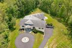 Fully available!! Welcome to this incredible 4-bedroom 7, 693 square-feet Contemporary home offering an additional 1, 444 square-feet of an indoor pool and entertaining area. This home is situated privately on 10.65-acres of property. A circular driveway with a fountain welcomes you as you travel along the tree lined driveway to the main entrance. Upon entry, you will be instantly thrilled with the impressive open concept floorplan. 21-foot cathedral ceilings boast throughout the formal living room and dining area. Relax by the gas fireplace while you listen to music wired for surround sound or just observe the indoor pool area from the massive wall of windows. Spacious kitchen merges with the grand living and dining area and includes an island, granite countertops, double ovens, 2 built in microwave ovens, locking natural gas cooktop with hood, extra quiet dishwasher, trash compactor, custom cabinets including soft close drawers and walk-in pantry. Master bedroom suite with sitting area, walk-in-closet, shower with dual shower heads and jacuzzi tub. Replica Oval Office provides the perfect space to work from home with direct exterior access. Escape year round to the luxury resort style indoor temperature-controlled salt-water pool and jacuzzi with a see-thru glass end. Filtration system and two tankless water heaters recirculate water continually to keep fresh water in both. Entertain guests in this spectacular pool area which includes an abundance of space fully equipped with radiant heated floors, an audio sound system, hibachi table/grill and adjacent outdoor patio. Fully functioning soundproof recording studio, separate control room and bonus room with removable performance stage. Indoor/Outdoor heated and air-conditioned dog kennel. This home offers a potential accessory apartment or mother/daughter with a full kitchen and full bathroom. Zoned for a potential bed and breakfast, home occupation, professional office & professional studio uses the opportunities are endless. Located just 1.7 miles from Metro-North Trains New Hamburg station and conveniently located to I-84, NYS Thruway, Taconic State Parkway and Route 9.