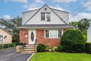 Experience an incredible and rare opportunity centrally located in the beautiful Village of Williston Park! This immaculate expanded and dormered cape offers nearly 2000 square feet of living space, not including the full finished basement. Newly renovated and tastefully appointed, this home is truly turn-key. The main floor boasts a beautiful kitchen with granite countertops, a large living room with an open-concept dining area, gleaming hardwood floors, a full bath, and a large primary bedroom with an adjoining office/custom closet/fourth bedroom. The second floor features a large open-concept living area with a wet bar and cabinetry, a second primary bedroom, a sizable second bedroom, and a full bath. Additional features include a full finished basement with an outside entrance (OSE) and an oversized detached garage. The unbeatable location is just a quick stroll to town, offering many restaurants, bars, shopping, and services such as mass transit and the Long Island Rail Road. Low taxes without STAR, central location and pristine appearance make this home a must-see!