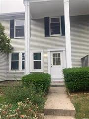 Charming lots of natural light Clean Condo, Hard wood Floors,  First floor features Lr , Dr, Eik, Half Bath. Second floor 2 bedrooms/closets, Full bath. Utilities are not Included