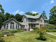 Enjoy the best of Country Living in this unique Armonk Farmhouse on two bucolic acres with wrap-around front porch in the Award Winning Byram Hills School District. This well-cared-for home offers 3800 square feet w/4 Bedrooms & 3 Baths and includes a 1500 sqft newer, first-floor primary suite w/an open, vaulted family room, dining area, butler&rsquo;s pantry w/laundry & private entrance. Double sets of French doors open onto an expansive patio for family gatherings and views of the bucolic grounds and majestic sunsets. The 700 sqft studio above the detached 2-car garage offers space for creative aspirations, a gym or private workspace. Bordered by 30 acres of protected Land Trust property guarantees privacy and having nature as your forever neighbor. Embrace Country Living in this thoughtfully expanded Armonk home, just minutes to Bedford, Greenwich and Armonk Square w/restaurants, shops and all the amenities of this charming town. Come see it today! Additional Information: Amenities:Storage, HeatingFuel:Oil Above Ground, ParkingFeatures:2 Car Detached, ConstructionDescription: Aluminum Siding, Vinyl Siding,