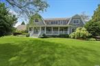 Be in for Summer at a great NEW PRICE! Experience quintessential Hamptons style in Remsenburg, at this coveted location just south of South Country Road. The custom estate was built in 2004, and is nestled on nearly an acre, offering 4, 000+/- SF of living space. Curb appeal abounds with the charming covered front porch & cedar shingle exterior. The first floor boasts seamless flow from the double height, entry foyer to a formal living room, dining room, and an open great room with a stunning stone surround, wood-burning fireplace, and French doors leading to the expansive back deck and pool area. The chef&rsquo;s kitchen features custom wood cabinets, granite countertops, dual sinks, and top-of-the-line appliances including Sub Zero refrigerator, Bosch & Thermador dishwashers, Thermador double ovens & gas range, and Sub Zero drink fridge. Adjacent is a sunken den with a wood-burning fireplace and closely located full bath with walk-in shower, perfect for guests. Upstairs, the ensuite bedroom features a balcony overlooking the backyard and a bathroom with a luxurious walk-in steam shower. A Jack & Jill bedroom setup offers convenience with separate shower and vanity access. Another bedroom includes a gas-burning fireplace and ensuite bath with shower/tub combination. The master suite is a retreat with a gas-burning fireplace, dual walk-in closets, a spa-like bath with double vanities, 2-person 30 jet soaking tub, walk-in steam shower, and access to a private balcony. Outdoors, enjoy nearly 1 acre of lush grounds with a play set, oversized deck, pool, and jacuzzi. Additional features include a Belgium block lined gravel driveway, radiant heated floors (tile), central vacuum, home security alarm, built-in speakers, a 1.5 car attached garage, and low Remsenburg taxes. Don&rsquo;t miss out on this exceptional opportunity. Schedule your showing today!, Additional information: Interior Features:Lr/Dr, Separate Hotwater Heater:Y