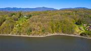 Hudson River Waterfront! An extraordinary opportunity awaits to build your dream home. Spanning 5.4 acres, this lot boasts 200 feet of pristine river frontage. Unlike many other properties along the Hudson, this lot is free from the obstruction of railroad tracks, offering unspoiled views and direct access to the river. The road to the property has been roughed in, electricity is already buried on-site, and permits for a boat ramp and dock have been previously granted. The neighboring lot is also for sale and offers an additional 2.2 acres. These lots can be bundled, giving you a combined total of 7.6 acres. This additional space expands the possibilities for creating a private, expansive estate.