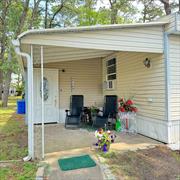 Step into refined comfort and community in this newly renovated 2-bedroom, 1-bathroom mobile home nestled in Riverwoods, an active 55+ community. Freshly updated in 2024, this residence radiates modern appeal and practicality. The enclosed porch at the entrance can serve as a versatile third bedroom or an office area, catering to your lifestyle needs. The home features central AC and forced-air heating for year-round comfort. A newly revamped laundry area with a washer and dryer adds convenience. Enjoy the propane gas stove in the kitchen for culinary delights. Outside, a private driveway, and a useful shed for storage. Monthly maintenance fees of $900 cover land use, water, sewer services, and include access to the community gym and clubhouse-an inviting space for social gatherings and activities. Don&rsquo;t miss out on this exceptional opportunity! The rent includes taxes, water, snow, and trash removal, along with cesspool maintenance. All applicants must pass credit, financial, and background checks conducted by management to maintain a secure community environment., Additional information: Interior Features:Lr/Dr, Min Age:55