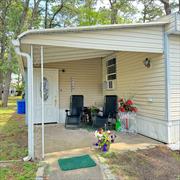 Step into refined comfort and community in this newly renovated 2-bedroom, 1-bathroom mobile home nestled in Riverwoods, an active 55+ community. Freshly updated in 2024, this residence radiates modern appeal and practicality. The enclosed porch at the entrance can serve as a versatile third bedroom or an office area, catering to your lifestyle needs. The home features central AC and forced-air heating for year-round comfort. A newly revamped laundry area with a washer and dryer adds convenience. Enjoy the propane gas stove in the kitchen for culinary delights. Outside, a private driveway, and a useful shed for storage. Monthly maintenance fees of $900 cover land use, water, sewer services, and include access to the community gym and clubhouse-an inviting space for social gatherings and activities. Don&rsquo;t miss out on this exceptional opportunity! The rent includes taxes, water, snow, and trash removal, along with cesspool maintenance. All applicants must pass credit, financial, and background checks conducted by management to maintain a secure community environment.