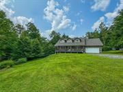 Introducing 114 Turkey Hollow! This charming, one-owner three bedroom home sits on a quiet dead-end road inside Willowemoc Wild Forest, just fifteen minutes from Livingston Manor&rsquo;s bustling Main Street. Who says you can&rsquo;t have it all?Sitting back off the private road, the house is well-positioned for both privacy and sunlight, with a a sweet rocking chair porch to while away the evenings. From here, you&rsquo;ll enter through the front door into the double height foyer. To your right, a spacious dining room with lovely bay window leads you back towards the generous kitchen. You&rsquo;ll find plenty of cabinetry and counter space here, allowing room to stretch your culinary muscle. This then opens into the living room area, with windows onto the back lawn and surrounding trees. Off of this space is another gathering space currently used as a game room with pool table and dart board. Completing the first level is a half bath and direct access to the large two car garage.Upstairs you&rsquo;ll find two sunny guest bedrooms plus a generous full bath. The primary suite is incredibly spacious, with a large sitting room, washer/dryer closet and sunny bedroom. Additionally, there is a large two-roomed walk-in closet that has been rough-plumbed for a primary bath. Pick your fixtures and your flooring - the hard stuff has already been done!A large, walkout basement with french doors also offers additional space to expand, should you want to add a workout space, home gym or movie room. The lot has plenty of cleared, flat land for you to develop. A pool or spacious entertaining deck would both be really at home here. Just five minutes from James Beard-nominated The DeBruce, fifteen minutes from all the attractions of Livingston Manor, and two hours from the George W. bridge, 114 Turkey Hollow makes a great place to call home!