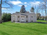 Incredible opportunity! Expanded sprawling raised ranch on a perfect flat oversized half acre lot. Property is sitting at the end of a cul-de-sac in the highly desirable Smithtown Schools. Practically new construction! New expanded blacktop driveway with paver border and skirt. Custom paver walkway and retaining walls, brand new roof, cedar impression front siding. Soffit lighting. Grand entry with white columns. Large wooden deck with portico and paver patio, great for entertaining! Two car attached garage. Open floor plan, vaulted ceilings, wrought iron staircase, recessed lighting, hardwood floors. One of a kind custom fireplace with mantle, and board and batten accent walls. Chef&rsquo;s kitchen with white cabinets, granite countertops, black stainless steel appliances, lots of cabinet and counter space, large center island. Enormous primary suite. Single one panel white doors. Spa like primary bath with enormous standup glass shower featuring marble tile and hexagon floor. Additional spacious bedrooms, breathtaking hallway bath with tub and glass shower. Exquisite den/family room with white marble flooring with gray veins, recessed lighting. Two additional bedrooms. Third spa bath with shower and tub. Private laundry room, two car attached garage. New 2 zone CAC and brand new forced hot air system.