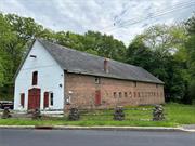 Imagine living in a historic brick Carriage House with an industrial chic twist. At your doorstep is 1538 acres preserved for wilderness and wildlife, with 2 lakes and 8 miles of biking & hiking trails. This property is contiguous to Blue Mountain Reservation and was once part of the large estate that donated this land. Exposed hand hewn beams and remnants of the original horse stalls are preserved in this 35&rsquo; x 100&rsquo;,  2 story barn. Fantastic opportunity if you need a live/work environment. Currently an amazing photo studio with 1 bedroom and 1.5 baths plus a kitchen/ living room area. There are endless possibilities for the creative spirit to create a unique living environment. The entire 2nd floor, currently used for storage, could be converted into several additional bedrooms. Plus many updates including extensive electric, split AC units, radiant heat, on demand water heater and a security system. Located at the doorstep of the Reservation and Depew Park, 5 minutes from the Hudson River, Charles Point Marina, Metro North and only 50 minutes to Manhattan. If you ever dreamed of living in a historic barn, this property checks all the boxes and is a dream come true.