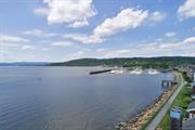 Enjoy resort living at Half Moon Bay in fantastic Croton on Hudson, the best place to live in NYS (USA Today): 2 pools, 2 tennis courts, 2 clubhouses, playground, gym, sauna, bike path, riverwalk, jitney to train, parks on either end, 46 min NYC express. Kayak, paddle, sail, hike, bike, kiteboard right outside your door. This sophisticated renovated 2 bedroom 3.5 bath townhome lives like a 3BR plus offices. Enter through private foyer up one flight to the main level w open plan living/dining room w gas fireplace, private balcony with seasonal river views overlooking the treetops, 2nd bedrm w en suite bath, powder rm, laundry, incredible amount of closet space. Upstairs, the master suite features a large office area, huge walk-in closet, a spa bath w enormous shower, double sinks, additional office nook, studio with en suite bath, attic. Among Westchester Magazine&rsquo;s top 10 most sought after places to live, it offers a lifestyle unavailable elsewhere.