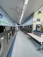 Location: This laundromat is strategically located in a bustling shopping center, attracting a steady stream of customers throughout the day. Its prime location ensures high foot traffic from nearby residential areas, retail stores, and office complexes, with parking most the time available,