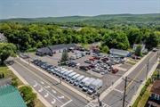 Introducing an exceptional opportunity for retail/vehicle-related investors. This impressive property (comprised of 4 adjoining parcels) located at 73 Kingston Ave, Port Jervis, NY, offers a 4, 000 SF building with vehicle showroom, 5 service bays and large parking lot. Currently, there are two tenants occupying the building spaces and a third tenant leasing parking lot space. Built in 1980, the property is well-maintained and conveniently zoned SC, providing an ideal environment for a range of retail or vehicle-related businesses. With 100% occupancy, this investment presents immediate income-generating potential. Embrace this prime location in the thriving Port Jervis area and leverage the steady demand for retail and vehicle-related services in this dynamic market. This offering includes 73 Kingston Ave, 75 Kingston Ave, 77 Kingston Ave and 15 Hamilton St all adjoined totaling 1.95 acres. Seize this extraordinary chance to expand your portfolio and secure a valuable asset with promising returns.