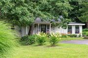 This delightful country house is privately set on 2.75 beautifully landscaped acres in the Town of Ancram, Columbia County. It will make a wonderful full-time residence or weekend country retreat! Meticulously maintained by the current owners, this home is move-in ready. Within, you will find a light-filled kitchen that opens to a lovely dining room with French doors to a cozy sunroom.  The first level also includes a spacious living room with a gas stove, two bedrooms, an office, and a full bath with laundry. The upstairs features a spacious, private primary bedroom suite. This adorable house is sited on a knoll and it boasts a wonderful front porch, rear deck, and a very private yard with lush landscaping. There is a large barn, plenty of room for storage or perfect for a workshop.  A short drive to Route 22 and to the Village of Millerton makes it a very convenient location. Enjoy the vibrant life of the Village with its many shops, restaurants and theatre, as well as the many outdoor activities nearby on the Harlem Valley Rail Trail, Catamount Mountain, and numerous hiking trails.  30 minutes from Hudson and Great Barrington, 20 minutes from Wassaic Metro North train station, and under two hours from New York City.