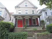 This two-family front-porch charmer is on a lovely, tree lined street. The house is solidly built featuring a new roof, new siding and new windows. The first floor (unit 1) offers a large living room with charming bay window and brick wall, French Doors into large BR, kitchen, dining area and full bath. There&rsquo;s a door from the kitchen out to the spacious, private backyard where you can gather with friends and family. The second and third floors comprise the 2nd unit which offers an eat-in-kitchen w/large pantry, dining room, living room, 4 BRs and full bathroom. Close proximity to highways and public transportation to NYC. Full basement with bilco doors lead to the backyard. The house is heated by oil and has wonderful iron radiators throughout. Wood floors as seen and charming details such as coffered ceiling, brick wall and gable roofline. There are many other functional upgrades and with a little bit of design creativity this lovely home could be even more amazing.