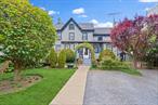 What a treasure! This darling 1838 Victorian, 1704-square-foot, four-bedroom, 2 bath home, tucked between two businesses in downtown Oyster Bay Village, just steps from the waterfront park and beach, might remind you of the animated movie, Up. But you need not tie balloons to it and fly away. Opportunities abound from restoring it to its Nineteenth Century sea-captain-like heritage, options are endless perhaps a charming shop, business, living in it yourself, or transforming the entire property into a commercial building. Sitting back from the street, it features a fenced front yard with tree, lawn, parking area, and gated entry. It is entered from an enclosed porch to a center hall with dining room and eat-in-kitchen to the left and a cozy living room with fireplace and powder room on the right. Four bedrooms are on the second floor. The unfinished attic, with five windows, is accessed by Bessler stairs, and the basement, with laundry and storage area, has BILKO stairs to the outside. Oyster Bay Village is a destination for weekend exploration with its waterfront park and marina on scenic Bay, plus quaint village shops and restaurants, and President Teddy Roosevelt&rsquo;s home/museum. Its train station, just steps from the house, provides an easy commute to New York City, forty-four miles away. View 3D tour and floor plan.