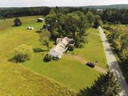 Beautiful scenic 64 acres of farmland with a combination of open fields and woods adjoining the Lake Superior State Park of more than 1400 acres. A lovely three bedroom ranch overlooks the fields with a stately view. A large living room with a fireplace, a formal dining room, sunroom, three bedrooms, two full baths, a full attic and a two car garage round out this old style farmhouse. At the back of the property is a nice brook with some wetlands. The inside of this home has been completely renovated. All new flooring, bathrooms, kitchen and paint. All furniture and flat screen TV&rsquo;s go with the sale. There is a new oil burner and hot water heater. The house will be completely repainted on the outside, in the garage, basement and new perimeter drains will be put in all around the home. The seller will dig down around the foundation and coat foundation to prevent any water coming in. They will also build a 2500 sq ft deck in the back of the home. The property is very close to Lake Superior State Park, Bethel Woods, restaurants and shopping only two hours from NYC in the Town of Bethel, NY New pictures have been added of the renovated inside of home.