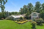 Positioned on one of the finest pieces of Great River real estate, this stunning waterfront home offers the perfect blend of elegance, comfort, and functionality. This unparalleled property with its mature landscaping, boasts an exceptional private dock, ideal for boating enthusiasts and outdoor living spaces for serene waterside relaxation. Step inside to find an exquisite indoor pool just off the kitchen-perfect for year-round enjoyment and entertaining. Delight in the breathtaking water views from the living area with entertaining bar. A spacious and comfortable mother-in-law space features its own separate entrance, a cozy living area, a private bedroom and full bathroom-offering the perfect blend of independence and accessibility for guests or extended family. Wake up to stunning water views in the beautiful primary bedroom, with private outdoor patio, his-and-hers closets, and a spa-inspired bathroom adorned with Italian stone finishes. Whether you&rsquo;re seeking a tranquil retreat or an entertainer&rsquo;s dream, this property has it all. Gated and completely private, built with high standards and pride of ownership, this home is a must see. Call to schedule your private tour. This is waterfront living at its finest!