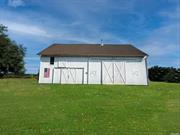 24.2 Acre Equestrian Dream Property in the Heart of Mattituck! This beloved homestead features a white farmhouse and 5 BARNS! Property is subdividable, comprised of two lots, 4.18 acres Development Rights Intact with 244&rsquo; of main road frontage and 20 acres of DRS agricultural land. Farmland has 2 irrigation wells and natural pond. Zoned R-80. APPROVALS IN PLACE FOR COMMERCIAL RIDING ACADEMY with Town. Barn 1 is two-story 2400 sqft, 1800&rsquo;s barn, restored. Barn 2 is 600 sqft built in 2015. (2) 400 Sqft Barns. Sunken sand riding ring in progress, paddocks to be built and customized. Owner is builder and can customize as residential homestead, farm winery with vineyard or complete your dream equestrian site. House is gutted and permits are pending. Property being sold as-is. Some photos are renderings or have been enhanced.