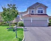 Magnificent Townhouse overlooking the golf course within sought after gated community, this exceptional home boasts 2 car attached garage, full basement, fireplace, master bedroom and 4 additional bedrooms in almost 4000 SF of living space.