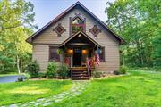 Introducing Wolf Lake Chalet! This beautiful custom built chalet style home checks all of the boxes. This home boasts 1, 600+ square feet, 2 bedrooms and 2 full bathrooms. Enter through the custom front entrance with intricate woodworking and be met with a vaulted ceiling open concept. Wood accents don the living room and kitchen accompanied by custom shaker style cabinets and custom tile flooring. A partially finished basement can be easily converted into a home gym or additional living space. The primary bedroom with en-suite is located in the private loft section with walk-out balcony. Vinyl cedar shakes, custom woodwork and custom stone work make the exterior aesthetic second to none. Included in the sale is a paper lot in the Emerald Green HOA. This provides access to the newly renovated lakefront beach access, in-ground pool, entertainium, gym and sports courts. Located 1 mile from State Route 17 and within 2 hours from NYC. Epitomizing privacy with modern convenience!