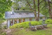 Nestled in the lush Bashakill Preserve sits this 1920&rsquo;s 2 bedroom, 2 bath storybook cottage filled with enchanting details. The previous owner was an artist and her husband a contractor, so the marriage designed a home of deep comfort and beauty. The many large windows and glass doors create a light-filled kitchen and dining area that opens to a patio ideal for both small and larger gatherings, the cozy living room extends to a sweet sitting area perfect for a good book and a cup of tea. The first-floor bedroom has a full bath complete with a soaking tub. The second floor has a reading/resting nook, 2nd bedroom and full bath. Located next to the Basha Kill preserve with over 3000 acres of wetlands and forest to explore and under 3 miles to Route 17 for easy commuting. Situated on a lovely country road and minutes to the Bashakill winery, Bashakill Educational center, local shopping in Wurtsboro with its quaint shops and art galleries and a host of many other attractions makes this the perfect weekend escape or full-time home that will provide continuous enjoyment and serenity. Additional Information: HeatingFuel:Oil Above Ground, LeaseTerm: Over 12 Months, 12 Months, Appliances: Electric Water Heater ConstructionDescription: Wood Siding,  LeaseTerm: Seasonal,