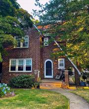 Make this charming brick Tudor your new home. The property is situated on a spacious corner lot in the vibrant village of Malverne, easily walkable to local shops, restaurants, and the LIRR. Stepping through the main entry into the foyer, archways lead you into the living room with a wood-burning fireplace. A formal dining room, kitchen with breakfast nook, half bath, and a three seasons room complete the main floor. Three bedrooms and a full bath with tub and shower stall are located on the second floor. An unfinished attic awaits on the third floor, which can be made into a fourth bedroom, home office or playroom.