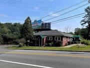 Commercial property next to Interstate 84 Port Jervis for sale. The access to the restaurant is from South Maple Ave on NY side and from River Rd on NJ side. The restaurant is vacant, but the owner still use the lower floor to run a business. The restaurant building sits on NY/NJ boarder - part of the restaurant is on NY side and part of the restaurant and parking lot is on NJ side. The NY side has 0.48 Acre and NJ side has about 1 acre. You can service both NY and NJ residents.