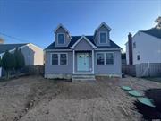 New modern Cape Cod style home with living room and fireplace. Eat in kitchen featuring gray soft close cabinets and a functional island. Stainless steel appliances included. Hard wood floors throughout. C.A.C. Not in a flood zone. Very few new homes available at this price.