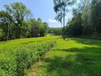 This tranquil 5.25+/- acre building lot is the perfect choice for nature lovers and those who want their privacy. Located in The Highlands, a premier gated country community just across the street from Bass Master Hunter Lake. Small upscale secure community puts privacy, peace and serenity at the forefront, and is very near to all the beauty and fun that the Sullivan County Catskills has to offer yet makes you feel worlds away. Enjoy the small babbling brook that runs through this beautifully sloping and level lot nestled in nature. Loaded with abundant wildlife and a mix of evergreen and deciduous trees. There appears to be a potential pond sight and lovely stonewalls meander through the property. Jaketown brook snuggles up to the rear according to the maps. This beautiful homesite is just minutes from Bethel Woods Center for the Arts, area lakes, hiking trails, Resorts World Casino, Kartrite Water Park, Monticello Motor Club, great restaurants and more! Additional Information: SoilType:Unknown,