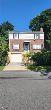 Charming 1949 Colonial - A Canvas for Your Vision Discover the untapped potential of this classic brick Colonial, nestled in the heart of Fleetwood. While this home is brimming with character, it awaits a discerning buyer ready to infuse their personal style. The spacious living room, complete with a cozy fireplace, offers a blank canvas for your dream living space. The kitchen, although functional, presents an opportunity to create a culinary masterpiece. Upstairs, the master suite and additional bedrooms provide comfort. The partially unfinished basement offers storage space and easy access to the underground garage. Step outside to your private oasis, where a cascading backyard awaits your landscaping vision. Enjoy the beauty of nature while the built-in sprinkler system provides a head start on creating your outdoor sanctuary. This home is a rare find for those seeking a property with character and the freedom to create their ideal living space.