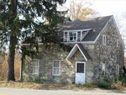 Checkout this very unique move in ready home today. This Benjamin Woodruff Home is estimated to have been built in 1790. Built with local rock with thick walls. Because of that the windows have a unique set in with wide & deep sills. Your pets will love to lay in the sun on them. Mostly has the original floors. Nice size kitchen with lots of counter space. Convenient dining area with fireplace for easy serving of meals. Very comfortable living room with fireplace & those great windows! Large first floor bedroom and bathroom. On the second floor there are three bedrooms. The one bedroom could be your home office. A full bathroom rounds out the second floor. In the back of the home with a park like private back yard with many different kinds of flowering bushes and perennials. A one car garage which needs some work. New furnace 2023, roof & gutters 2024. Close to all of your shopping needs, major highways, bus, and train connections! This truly unique home is priced to sell quickly.