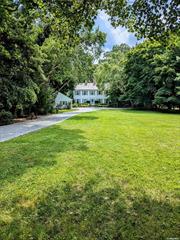 Classic colonial home on Conscience Bay with deepwater dock and beach frontage. Large eat-in kitchen, fireplace in front-to-back living room with pegged hardwood floor, and formal dining room on first floor, with a view of the bay from its southeast side. Fully finished lower level includes large den with a second fireplace, and a full bath, with glass sliders out to patio and backyard, which leads to water frontage. Substantial front yard and drive give considerable setback and privacy from road. Detached 2-car garage with electricity.