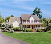 Discover this charming 4-bedroom 2 1/2 bath, 3078 Sq Ft home on 1.57 acres minutes from the quaint Village of Pawling. At entry, step onto a beautiful wrap-around front porch, perfect for enjoying your morning coffee or unwinding in the evening. The inside foyer leads you to this bright first level, where a spacious double-sized family room awaits. Abundant natural light floods the space, highlighting the beautiful hard wood floors & propane fireplace that adds both ambiance and warmth during the winter months for those cozy evenings, especially during the holiday season. Off the living room is a SGD leading you to a newly rebuilt deck, offering peaceful views of the large and well manicured yard an ideal spot for outdoor gatherings, yard games or just quiet reflection. The kitchen features granite countertops, pecan cabinets with soft-closed drawers, a convenient pull-out cabinet, and a tiled floor. Conveniently located next to the kitchen is the dining room, also with hard wood flooring.  On this level, is direct entry to the 2-car garage and a dedicated laundry area adding to the home&rsquo;s functionality. Moving to the upper level, the large primary bedroom features both a walk-in and a spacious double closet. The private bathroom has a double sink vanity, soaking tub, and separate shower. Additionally, there are 3 additional bedrooms one of which is very generously sized. Finally, the hall bathroom shows another double sink vanity with tub/shower.  On the lower level, there is approximately 630 sq ft. of wonderful living space in addition to a large separate storage area. This finished basement features a wet bar and a sliding glass door leading you to an ample stone patio giving you more outdoor space to enjoy. The combination of a level yard and a wooded area creates a serene and picturesque environment. Whether it&rsquo;s for relaxing, outdoor activities, or simply enjoying the view, such a setting offers a wonderful escape into nature. For a small fee enjoy summer swimming or camp for the kids at Lakeside Park only 6 minutes away. Winter fun is offered at Thunder Ridge Ski Area to ski or snowboard. This home offers the perfect blend of classic charm and modern convenience, creating a warm and inviting atmosphere for you and your family. Conveniently located minutes to Metro North, Golf courses, Rail & The Appalachian Trail, restaurants and more. Additional Information: HeatingFuel:Oil Above Ground, ParkingFeatures:2 Car Attached, ConstructionDescription: Vinyl Siding,  Flooring: Carpet,  InteriorFeatures: Bar,