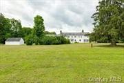 In 1912 Senator J. Griswold Webb built this majestic six-bedroom, six-bathroom colonial with five fireplaces that now sits on fifteen glorious acres. It could now be transformed into a Bed and Breakfast. This stunning true center hall colonial has front and rear doors with a beautiful archway. The formal dining room has a glass built in cabinets, a fireplace, and a hidden floor to ceiling safe. The generous sized main rooms have hard wood floors throughout, original detailed millwork, and plaster walls. The well-appointed rooms have tall ceilings, and the abundance of windows and French doors give the interior rooms extraordinary light. The living room has original glass built in bookcases and a fireplace. The study has oak built in bookcases and the full bathroom has splendid marble and tile. The enclosed porch off the living room runs the width of the house and has the original windows and doors. The jade colored tile floor is exquisite and the oversized stone fireplace is perfect for large gatherings on cool nights. The kitchen is sizable, quite suitable for a house of this size. This is a marvelous house for entertaining family and friends. The primary bedroom is on the second floor with an en-suite full bathroom, fireplace, walk in closet and dressing room. There are two additional full bathrooms that service the other four bedrooms. One other bedroom has a private entry, dressing area and fireplace. There are two additional rooms, that at one point were servant&rsquo;s quarters and could be used for storage, or large closets. The unfinished lower level has tremendous potential. It has several rooms, a wine cellar, cedar closet and another floor to ceiling safe. The old billiard room with its stone fireplace could be restored to its former glory. The house is a two-family residence. There is a two-story guest wing with a fireplace, separate entrance, kitchen, three bedrooms and three bathrooms. Ideal for guests, in-laws or for use as a rental property. Additionally, there is a 1500 square foot barn and three car detached garage. Very few houses remain in the county like the Beck House with unspoiled original details from this by gone era. The land boasts mature landscaping, ancient lilac, and magnolia trees in addition to other specimen trees. Originally a Guernsey farm, it was leased by Jack Dempsey&rsquo;s trainer as a training camp for the prize fighter prior to the building of the great house. This property is in the Millbrook School District., AboveGrade:5885, Below Grnd Sq Feet:250, ExteriorFeatures:Landscaped, FLOORING:Tile, Wood, InteriorFeatures:Walk-In Closets, Other School:DUTCHESS DAY, ROOF:Asphalt Shingles, Unfinished Square Feet:250