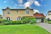 Spacious & Expanded Colonial Set On A 70x91 Property In East Meadow. With Over 2000 Sq Ft Of Living Space, It Is Conveniently Located Near Schools, Shopping, Restaurants, Transportation And Endless Recreation At Nearby Eisenhower Park.                                                                                                                                                                                                          This Home Features Sleek Tile Flooring, Recessed Lighting, A Sunny Front Entry With Walls Of Windows Which Ushers You Into A Spacious Living Room With A Marble-Surround Fireplace And Tall Windows Framing Backyard Vistas. The Kitchen Boasts Wood Cabinetry, Center Island And An Adjacent Large Dining Room, Two Bedrooms And A Full Hall Bathroom Complete The Main Level. The Second Floor Houses An Oversized Primary Bedroom With Vaulted Ceiling And Two Closets, Along With Two More Generous Bedrooms, Laundry Area And A Full Hall Bath With Tub/Shower Combo, Vaulted Ceiling And Skylight. A Fully Fenced-In Backyard & 1 Car Garage Complete This Property. Just Move In Unpack & Enjoy Your New Home ! Pre-Approval Or Pof Required By All.