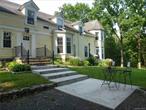 This three bedroom apartment in the historic town of Warwick, NY, is indeed a rare find. It boasts a beautiful 1.9 acre lot and carries the charm of the 1800&rsquo;s, evident in the gorgeous hewn beams and restored hardwood floors, among other details. The blending of historic charm with modern conveniences makes this apartment truly special. An updated kitchen, central AC and the convenience of a laundry room on the second floor, affords you the best of both worlds. One of the major perks of this apartment is the low-maintneance lifestyle it offers. Garden maintenance and snow plowing are taken care of, allowing you to enjoy the beauty of the surroundings without the hassle of upkeep. Parking is conveniently located just steps outside the front door.