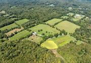 A marvelous opportunity to enjoy the finest in country living in the beautiful Hudson Valley. A picturesque farm in the heart of scenic Dutchess County, this property is a treasure. The circa 1783 house is privately set and is surrounded by approximately 120 acres of productive agricultural land and woodlands. The home, with almost 4000 square feet of living space, has been well cared for. The details throughout exude a warm comfortable feeling; spacious, inviting rooms, 2 fireplaces, and fabulous wide plank flooring. The main level features a living room, formal dining room, cozy office, large country kitchen, mudroom, powder&#160;room and a lovely primary bedroom suite. Three additional bedrooms, and a full bath are on the second floor.&#160; The house is set well off the road with a wonderful approach. Enjoy views of the mountains from the high point of the property and trails through the woodlands. An idyllic property, complemented by an inground pool, a pond, period barns, fabulous stonewalls and tree lined meadows. Convenient location, close to commuter routes, the Metro North station, and a short drive to the charming villages of Millbrook and Rhinebeck. 90 minutes from NYC!