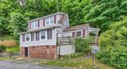 This charming cottage is tucked away in the foothills of the Catskills. Minutes to either New Paltz or Kingston, the town of Rosendale is a hidden gem. This is the perfect jumping off point to explore the Catskills. This adorable home features a fully equipped kitchen, a spacious living room, new mini splits for heating and cooling, new roof, two electric fireplaces for additional heat and ambiance, new septic leech-field, and a short scenic hike on the premises. Complete with two light filled bedrooms, and a very large bathroom, plus an additional dining room and work space. And to top it all off, it has a walk in basement as well. Needless to say, this house is the perfect home or weekend getaway.   Currently being utilized as an short term rental, it does have town approval and permit for an Airbnb.