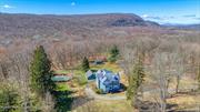 Welcome to this exquisite Victorian property in Esopus, where charm meets functionality in a serene setting. Esopus is one of several small hamlets in Ulster County founded in 1811. Don&rsquo;t miss the multiple correspondences letters from the 1800&rsquo;s found in the house with a photo of original owners. Perched atop a picturesque knoll, this meticulously kept home offers the perfect blend of historic elegance and modern comfort. As you approach, the circular drive sets the stage for the grandeur that awaits. The Victorian architecture exudes timeless appeal, while the meticulous upkeep ensures that every detail shines. Beautiful maples and pine trees grace the mature landscape. Inside, the heart of the home is undoubtedly the fabulous, spacious kitchen, where culinary delights come to life amidst ample counter space and top-of-the-line appliances. Whether you&rsquo;re hosting gatherings or simply enjoying a quiet meal, this kitchen is sure to impress. Off the kitchen is a spacious dining and living room with plenty of natural light. 1st floor bedroom off the main living area that could also be an office or den. The primary suite provides a luxurious retreat, complete with all the comforts you desire, while an adorable apartment offers flexibility for guests. With its own private entrance, it provides a sense of autonomy while still being connected to the main residence. Outside, the in-ground pool beckons on warm summer days, surrounded by a fenced-in area for safety and privacy. The private backyard offers a tranquil oasis, perfect for relaxation or outdoor entertaining. Don&rsquo;t Miss the 3 car garage with a work shop in the 3rd bay..Fireplace is unknown. Whether you&rsquo;re seeking a peaceful escape or a home that accommodates multi-generational living, this property in Esopus delivers on all fronts. Schedule a viewing today and discover the endless possibilities that await in this Victorian gem. Property consists of 2 parcels included in the price. Taxes and acreage are combined.