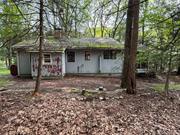 Embrace the lake life with this 3-bedroom home on Wolf Lake! This 1950s â€˜campâ€™ is bursting with potential, offering you the perfect canvas to create your ideal retreat. While this home needs total renovations, it comes with deeded lake rights, giving you access to the serene waters of Wolfe Lake. Imagine starting your mornings with a peaceful kayak ride, just a short stroll from your front door. Surrounded by the natural beauty and close-knit community of Wolf Lake, this property is your opportunity to transform a classic camp into your dream lakeside getaway! Additional Information: HeatingFuel:Oil Above Ground,