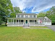 Nestled on 2 acres of scenic landscape, this charming colonial home boasts over 2, 000 sqft. of living space. Imagine unwinding on the wrap-around porch, surrounded by the tranquility of mature trees & seasonal mountain vistas. Built in 2001, this spacious residence features 3BR/2.5BA, including a primary suite with full bathroom. The main level showcases an inviting eat-in kitchen, formal dining room, & a generous living room, all adorned with original hardwood floors. Ample closet space & a convenient laundry room on the 2nd floor add to the practicality of the layout. The full basement offers endless possibilities for customization, whether it&rsquo;s a home office, gym, or entertainment area. For added versatility, a fully finished living space above the oversized 2-car garage includes a full bathroom, kitchen, & private deck, perfect for guests or extended family. Located just minutes from the town center, this property combines rural serenity with convenient access to amenities.