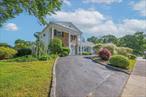 AN INCREDIBLE OPPORTUNITY! *Completely Renovated Colonial Haven in Port Jefferson Station, NY* Step into the enchanting embrace of this meticulously renovated Colonial masterpiece. Featuring 4 generously proportioned bedrooms and 3 luxuriously appointed baths across three levels, this home exudes elegance and sophistication from the moment you enter the welcoming foyer. The main floor boasts a seamless flow of functionality and charm with hardwood floors throughout. The spacious living room, bathed in natural light from large windows, creates an inviting atmosphere for gatherings and relaxation. The adjacent dining area leads to a chef&rsquo;s dream kitchen with top-of-the-line appliances, custom cabinetry, and elegant countertops, making it the heart of the home. A conveniently located laundry room adds practicality to the main floor. Ascend to the second floor, where hardwood floors continue, complementing the luxurious ambiance. The primary suite offers a spa-like en-suite bath and ample closet space, providing a serene retreat. Three additional spacious bedrooms and another full bath complete this level. The basement offers extra storage space, keeping your belongings organized and easily accessible. Nestled on a sprawling 9, 148 sqft lot, the property features a private driveway accommodating two vehicles. Revel in modern comfort and serenity with brand new bathrooms, sleek fixtures, and contemporary illuminated mirrors.Conveniently situated in the heart of Port Jefferson Station, this home offers effortless access to esteemed educational institutions and a variety of local amenities. This distinguished abode embodies the essence of HOME. Seize the opportunity to claim it as your own and embark on a journey of unparalleled refinement and fulfillment.