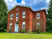 Leave you car parked & walk to Amtrak and the Hudson River from this 2 BR, 1 bath condo in Rhinecliff on Hudson. Enjoy low taxes ($3269), low common charges, low utility bills, & the charm of a 1920s brick building. Here there&rsquo;s a redone EIK w/dishwasher, a 14 x 16 LR, a nice bath with a tub/shower, 2 BRs & full laundry. Sited high on 1.4 acres, large trees & lush lawns make outdoor living a joy. There&rsquo;s abundant parking, Rhinebeck schools, baseboard hot water heat & a storage alcove. Rhinebeck village with its restaurants, parks, shopping, farmer&rsquo;s market, & superb hospital is just 2 miles away. Bard, Kaatsbaan, Omega, the Aerodrome, & the Culinary are all close by. Everything outside is taken care of for you, so this is truly carefree living!